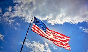 cropped-patriotic-american-flag-blue-sky-with-clouds.jpg